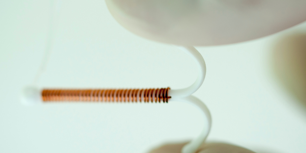 How does the copper IUD work as an emergency contraceptive?